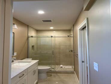 Photos by Dream Builders Home Improvement LLC Design, Construction and Management of Basement Renovation with a Wet Bar and Bathroom