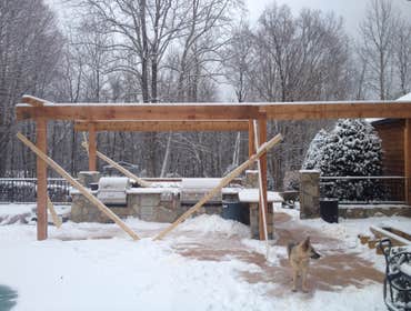 Photo(s) from Portante Clan Construction Llc Outdoor covered timber frame kitchen cover.