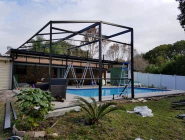 Photos by Orlando City Screening LLC #2 Removal of old pool cage and porch and building new porch covered with elite roof 40 x 18 and new pool enclosur