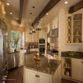 Historical Adobe Kitchen Remodel - Saratoga, CA An Adobe style kitchen remodel designed by CAGE Design Build, that features: - A new kitchen island wi