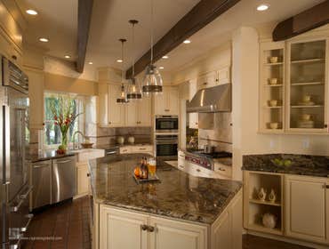Historical Adobe Kitchen Remodel - Saratoga, CA An Adobe style kitchen remodel designed by CAGE Design Build, that features: - A new kitchen island wi