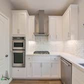 Full Home Remodel Full home remodel featuring a very modern take on a kitchen, fireplace, and bathroom. The color coordination throughout the home give