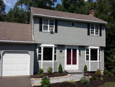 Vernon Raised Ranch This raised ranch style house had minor prep requirements with very little repair work needed. Shutters were given a coat of black,