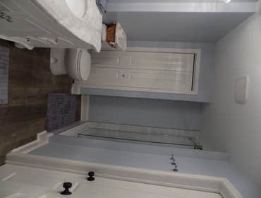 Photos by Middletown Kitchen & Bath LLC #1 Tile Shower Remodel with Shower Door and Furniture Vanity.