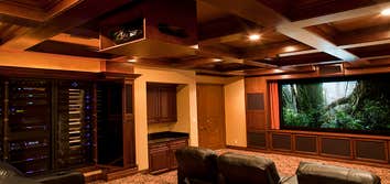 Various photos of a couple of the many professional installations Connected Technology has done. From full-blown home theaters to music, lighting contr