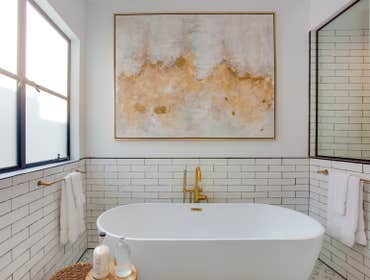 Boho Chic Master Bathroom We crafted a tranquil and private master bathroom, featuring an oversized walk-in shower, a freestanding tub, and his-and-her