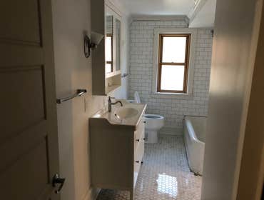 Indian Village Historical House - Bathroom Remodel We installed pluming, vanity toilet, ceramic tile, lighting, medicine cabinet, shower and bathtub.