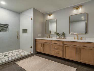 Encino bathroom remodel with double vanity, walk-in shower, and modern tile finishes