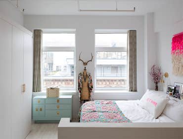 Silk Building Condo The one-bedroom, two-bath duplex had its main spaces opened through a reorientation of the kitchen’s storage. The dark oak floors w