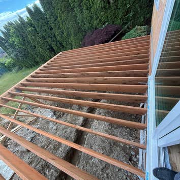 Deck & Outdoor living Complete structural deck framing for a residential outdoor living area. Scope included layout, beam and joist installation, fram