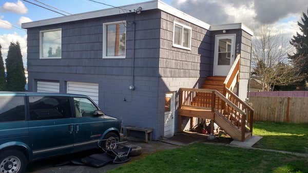 Exterior repairs, painting, window installation, new entry staircase