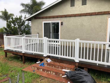 Vista composite deck Demoed old rotted deck and replaced with new composite decking and vinyl railings