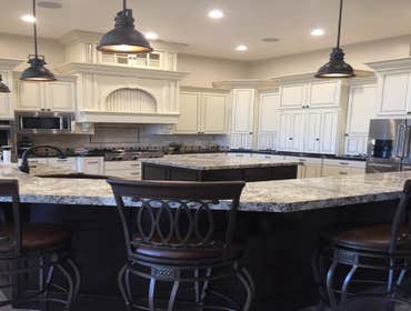 Custom Home Lot 2 Custom Home with open kitchen dining and family. Circular staircase, pool house and large patios. This is a great home!