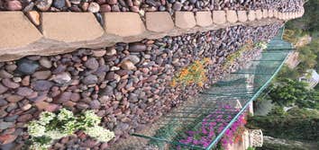 Epstein Keystone Blockwall with Cobble stone mulch
