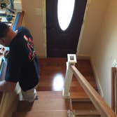 New Stairs Project in Hudson, Ma Brazilian Cherry Stairs with Railings and Metal Balusters and White Newels