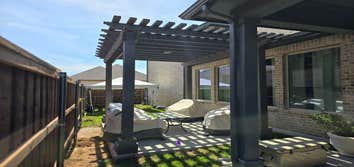 Pergola shade structure Painted cedar pergola, custom fabricated post plates.