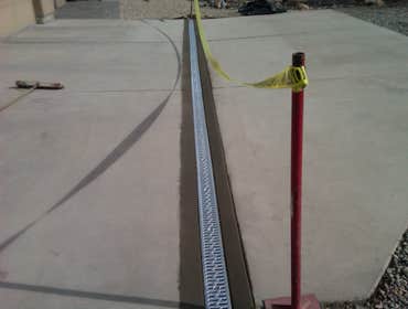Landscape Drainage Solutions Project 1 Channel drain install in driveway