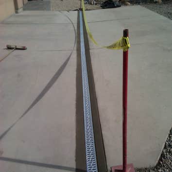 Landscape Drainage Solutions Project 1 Channel drain install in driveway