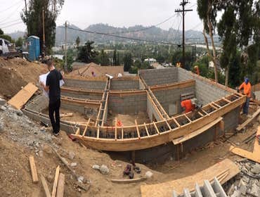 Mount Washinton Hillside land development including caissons/piles, grade beams, CMU block walls, retaining walls. All known as foundation and structur