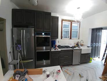 Photos by Pascal's Handyman Services, Design by Pal #10 Opened wall, for a new pantry.
New floor, island, cabinets, and appliances.