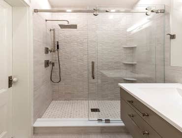 All white frameless shower remodel