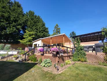 Photos by Stewart & Son Gate & Fence LLC #1 Tiny House with pergola. Small house 17' by 12' small bathroom with pocket door, and small sink with water 