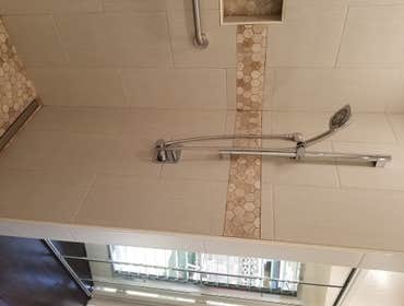 V. Jones Bathroom/Laundry Room Remodel - Tub to Step-in Shower Conversion with Linear Drain
- New Vanity, Toilet, Sink, mirror, toiletries
- All new fl