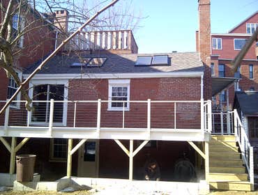 Historic West End condo remodel Complete remodel all finish materials used were reclaimed salvage lumber. Deck is made of aluminum decking with a stain