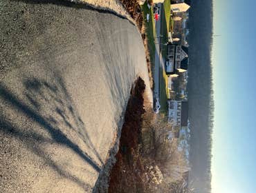 Photos by C&C Paving #5 -Graded stone for proper pitch
-applied 2 1/2 inches of 9.5 mm asphalt wearing course
- compacted asphalt with roller