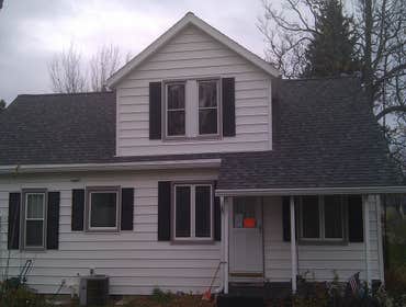 Dormer rebuild and reroof. Remove existing dormer and construct 4' wider and add gable roof,re-shingle entire roof,drywall interior and trim.