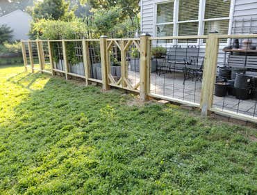 Photos by Emperor Fence LLC #2 Custom-made pressure-treated wood hog wire fence designed and built to provide durability, visibility, and a modern aest