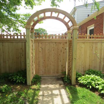 Cedar Fence with Arbor.