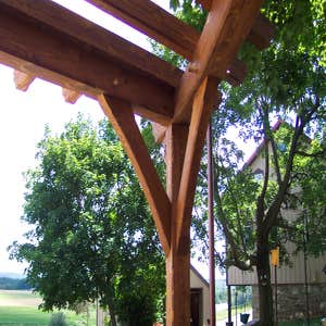 (2) Custom designed timber-framed pergola, timber-framed carport Each timber is hand carved to fit into the joining beam.