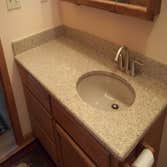Bathroom Upgrade Client requested we replace and upgrade, counter tops, sinks and fixtures.