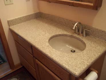 Bathroom Upgrade Client requested we replace and upgrade, counter tops, sinks and fixtures.