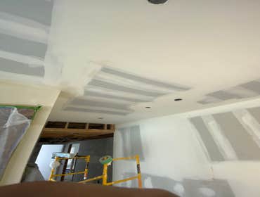 Photos by Interior Art Drywall Inc #1 Hang the walls on ceiling and walls . I just let the open on ceiling where plumbers were pending to fix the pipes
