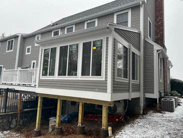 Covered Porch to 4-Season Room Conversion This project showcases the transformation of a traditional covered porch into a fully insulated, climate-cont