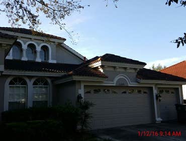 Photos from Popa Construction LLC Before & Afters of a soft wash roof cleaning and driveway and side walk cleaning.