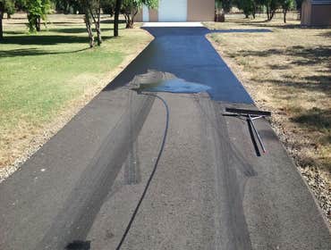 Apshalt Driveway Sealcoat This asphalt was allowed to cure for 1 year prior to sealcoating.