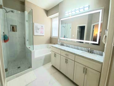 Photos by Trublue House Care of Allen #22 Full master bath remodeling. New bigger shower, tub, frameless panel glass, flooring, vanity, countertop, lig