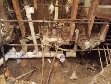 Remodeling Busted concrete in order to replace all cast iron sewer pipe which the bottom had rotten out. Replaced all pipe under slab for two one bath