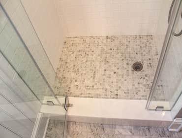 Baine Contracting Inc Project Multiple jobsites - showing kitchens, interior and exterior trim work, new homes, bathrooms, tile work, wood and iron ra