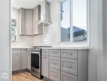 Reseda Kitchen Remodel We transformed this Reseda kitchen into your timeless, functional haven! Picture light gray cabinets with silver handles, paired