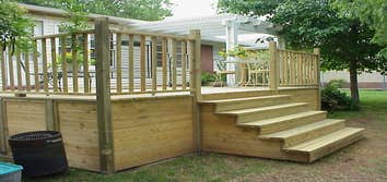 Baker Custom Deck with Pergola This Custom Deck was built over an old existing concrete patio. We even covered over the old concrete steps! This deck w