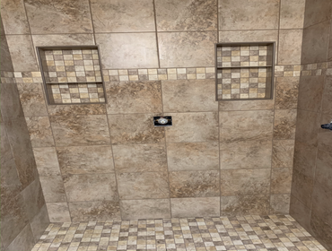 New shower in Tracy Replaced old shower with new. Added new ceiling shower head with separate valve, along with schluter shelves and hidden tiled schlu