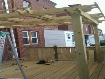 Photo(s) from Laur Moor Construction Two decks and a tiled kitchen floor