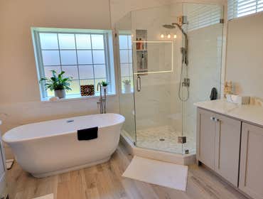 Photos by Trublue House Care of Allen #27 Full master bath remodeling. New bigger shower, freestanding tub, frameless panel glass, flooring, vanity, co