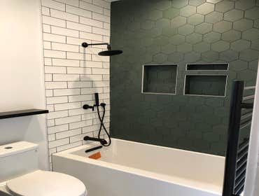 Custom tile, new tub, mixing valve relocation