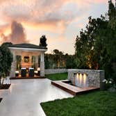 Urban Landscape Inc Project Custom Pool, covered structure, and landscape design and construction