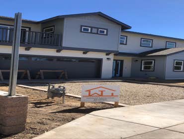 Curbaril Project A four home development. Installed foundations, site fencing, curbs, and driveways.